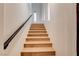 Bright staircase featuring wooden steps, modern railing, and ample natural light at 4162 Matterhorn Way, Las Vegas, NV 89124