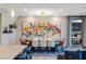Modern dining room with seating for six, elegant lighting, and artwork at 4290 Solace St, Las Vegas, NV 89135