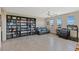 This spacious living room features built-in bookcases and three large windows at 4290 Solace St, Las Vegas, NV 89135