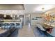 Open-concept floor plan with kitchen island, dining area, and living room featuring modern decor at 4290 Solace St, Las Vegas, NV 89135