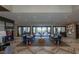 Bright lobby area with modern decor, two sofas, and a view to an outside lounge area at 4290 Solace St, Las Vegas, NV 89135