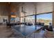 Inviting indoor/outdoor lounge with ping pong table, comfortable seating, and a warm, community atmosphere at 4290 Solace St, Las Vegas, NV 89135
