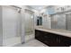 This main bathroom features a spacious walk-in shower, double vanity, and contemporary finishes at 4290 Solace St, Las Vegas, NV 89135