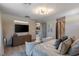 This elegant main bedroom features a tv, sitting area, and an ensuite bathroom at 4290 Solace St, Las Vegas, NV 89135