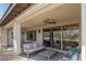 A covered outdoor living space with stylish seating, offering a seamless transition between indoor and outdoor living at 4290 Solace St, Las Vegas, NV 89135