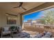 A covered outdoor patio offering a seating area, perfect for relaxing and enjoying the exterior view at 4290 Solace St, Las Vegas, NV 89135