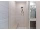 This bathroom shower offers seating and has clean, modern shower fixtures at 4290 Solace St, Las Vegas, NV 89135