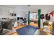 Spacious room featuring a view into an adjoining room, hardwood floors, and shelves for storage and organization at 4629 Denwood Dr, Las Vegas, NV 89147