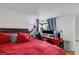 Comfortable bedroom featuring a large bed, a workspace and natural light at 4629 Denwood Dr, Las Vegas, NV 89147