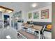 Bright kitchen featuring stainless steel appliances, mosaic tile backsplash, and a cozy dining area at 4629 Denwood Dr, Las Vegas, NV 89147