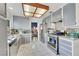 Bright kitchen featuring stainless steel appliances, ample gray cabinetry, and mosaic tile backsplash at 4629 Denwood Dr, Las Vegas, NV 89147
