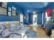 Bright living room with blue walls, stylish decor, and hardwood floors creating a relaxing atmosphere at 4629 Denwood Dr, Las Vegas, NV 89147