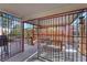 Enclosed patio featuring a grill, dining set, and a cozy outdoor living space at 4629 Denwood Dr, Las Vegas, NV 89147