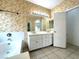 Bathroom featuring a shower and tub with white cabinets and tile flooring at 4713 Vista Del Rey Ct, North Las Vegas, NV 89031