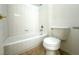 Bathroom featuring a white toilet, a white tiled shower over bath, and a tile floor at 4713 Vista Del Rey Ct, North Las Vegas, NV 89031
