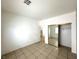 Bedroom with tiled flooring, a large closet, and access to the kitchen at 4713 Vista Del Rey Ct, North Las Vegas, NV 89031