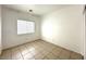 Empty bedroom with tiled floors, a window, and ample natural light at 4713 Vista Del Rey Ct, North Las Vegas, NV 89031