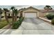 Charming single-story home with desert landscaping and a two-car garage at 4713 Vista Del Rey Ct, North Las Vegas, NV 89031