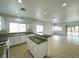 Open-concept kitchen featuring a breakfast bar and tile flooring at 4713 Vista Del Rey Ct, North Las Vegas, NV 89031