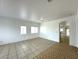 Spacious living room with neutral walls and tile flooring throughout at 4713 Vista Del Rey Ct, North Las Vegas, NV 89031