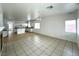 Spacious living room leads into the kitchen, featuring tile floors and an open layout at 4713 Vista Del Rey Ct, North Las Vegas, NV 89031