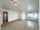 Open living room with modern lighting and tiled flooring at 4713 Vista Del Rey Ct, North Las Vegas, NV 89031