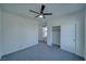 Bright bedroom features modern ceiling fan, plush gray carpeting and double door closet at 5091 E Beacon Ridge Dr, Pahrump, NV 89061