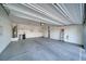Spacious and clean two car garage with ample lighting, plumbing, and plenty of room for storage at 5091 E Beacon Ridge Dr, Pahrump, NV 89061