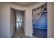 Open hallway features tile flooring, neutral paint, and leads into another room with carpet at 5091 E Beacon Ridge Dr, Pahrump, NV 89061