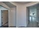Open hallway features tile flooring, neutral paint, and leads into the common areas of the home at 5091 E Beacon Ridge Dr, Pahrump, NV 89061