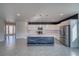 Spacious kitchen with a large island, stainless steel appliances, and tile flooring at 5091 E Beacon Ridge Dr, Pahrump, NV 89061