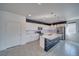 Kitchen featuring white cabinets, navy island, and stainless steel appliances at 5091 E Beacon Ridge Dr, Pahrump, NV 89061