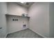 Laundry room with tile flooring and shelves at 5091 E Beacon Ridge Dr, Pahrump, NV 89061