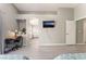 Bedroom featuring a work area, TV, and bathroom view at 517 Casa Del Norte Dr, North Las Vegas, NV 89031