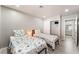 Cozy bedroom featuring two twin beds, closet with sliding doors, and a bathroom view at 517 Casa Del Norte Dr, North Las Vegas, NV 89031