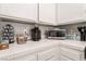 Kitchen counter featuring microwave, water, coffee maker and snacks at 517 Casa Del Norte Dr, North Las Vegas, NV 89031