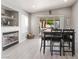 Dining area with modern lighting, fireplace, and outdoor access to a hammock at 517 Casa Del Norte Dr, North Las Vegas, NV 89031