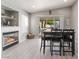 Modern dining area featuring black table and chairs and fire place at 517 Casa Del Norte Dr, North Las Vegas, NV 89031