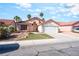 Charming single-story home with a well-maintained lawn, desert landscaping, and two-car garage at 517 Casa Del Norte Dr, North Las Vegas, NV 89031
