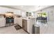 Bright kitchen features stainless steel appliances and white cabinetry at 517 Casa Del Norte Dr, North Las Vegas, NV 89031