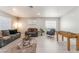 Comfortable living room featuring modern decor, soft lighting, and a foosball table for recreation at 517 Casa Del Norte Dr, North Las Vegas, NV 89031