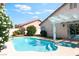 Backyard swimming pool with surrounding patio and landscaping at 517 Casa Del Norte Dr, North Las Vegas, NV 89031