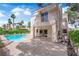 Back of home with pool, spa, patio, and second story balcony at 5205 Coral Glow Ct, Las Vegas, NV 89149