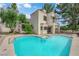 Exterior of home featuring a swimming pool, spa and second story balcony at 5205 Coral Glow Ct, Las Vegas, NV 89149