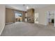 Spacious bedroom with a stone fireplace, large windows, and access to a luxurious bathroom at 5205 Coral Glow Ct, Las Vegas, NV 89149