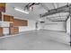 A spacious three car garage with built in cabinets and workshop area at 5205 Coral Glow Ct, Las Vegas, NV 89149