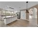 Kitchen with granite countertops, stainless appliances, a center island, and an archway at 5205 Coral Glow Ct, Las Vegas, NV 89149