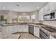 Kitchen area with modern appliances, granite counters and bright window with natural light at 5205 Coral Glow Ct, Las Vegas, NV 89149