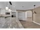 Bright kitchen with stainless appliances, granite countertops, island and a walk-in pantry at 5205 Coral Glow Ct, Las Vegas, NV 89149