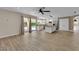 Open concept living area with kitchen, pool view, stainless appliances and wood floors at 5205 Coral Glow Ct, Las Vegas, NV 89149